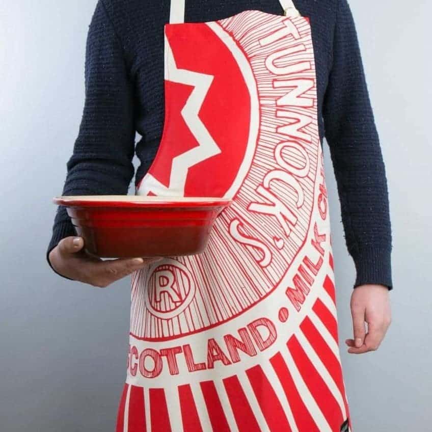 Kitchen Tea Towel with Tunnock's Teacake design by Gillian Kyle (on model)