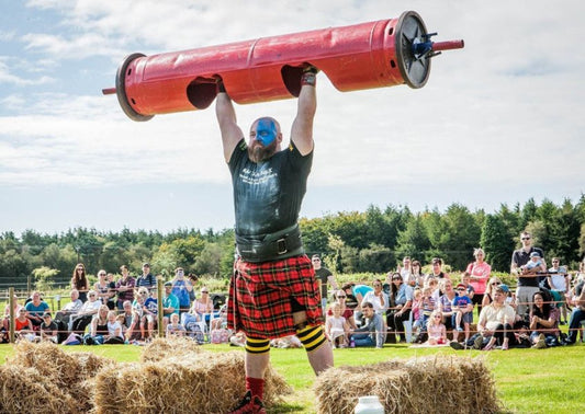 A woman is throwing the hammer at a Highland Games event