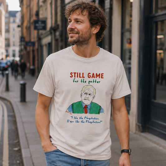 Man wearing a t-shirt with a graphic and text on a city street